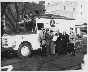 Leonard Dreyfuss and group next to Civil Defense Rescue Service truck, from the Leonard Dreyfuss papers, Mss 0001