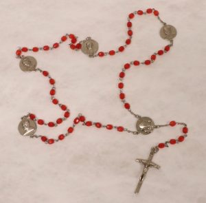 Rosary with made of red plastic beads and a metal chain and crucifix, Collection on Pope John Paul II (MSS 0004)