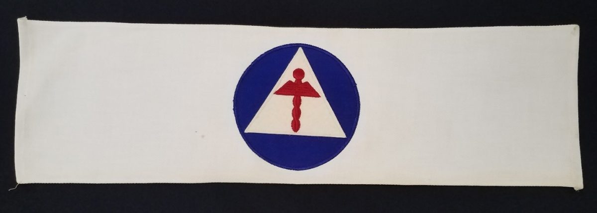 Civil Defense Medical Corp Armband, embroidered textile, mid-20th century, Leonard Dreyfuss papers, MSS 0001, Courtesy of Archives and Special Collections.