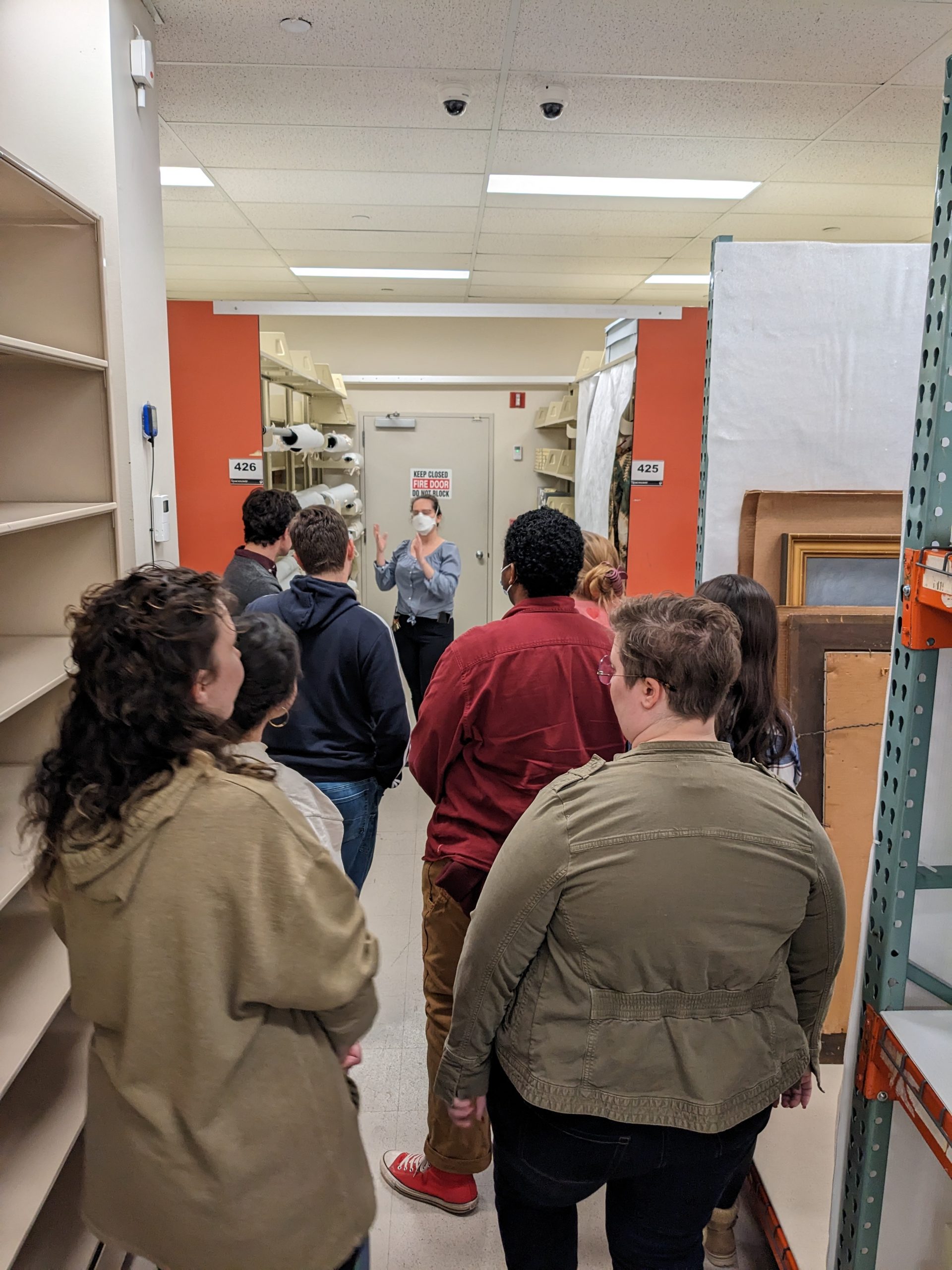 students in "Object Care" get a tour of the storage vault for collections