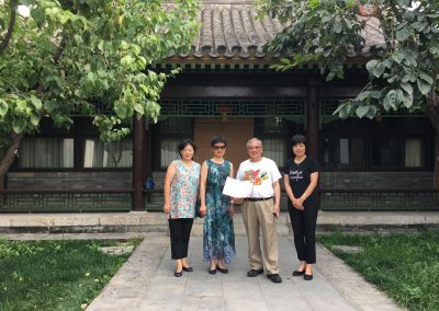 Receiving a certificate of my book donation from Tsinghua librarians