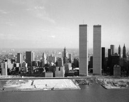 The World Trade Center in 1975: An aerial view of The World Trade Center after finally being completed after years of construction. The photo also features an aerial view of lower Manhattan and it captures the velocity of the height of these two buildings compared to the rest of Manhattan. 
