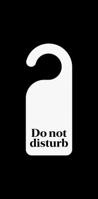 A black and white picture showing the placard we leave hanging on the hotel room door when we do not wish to be disturbed
