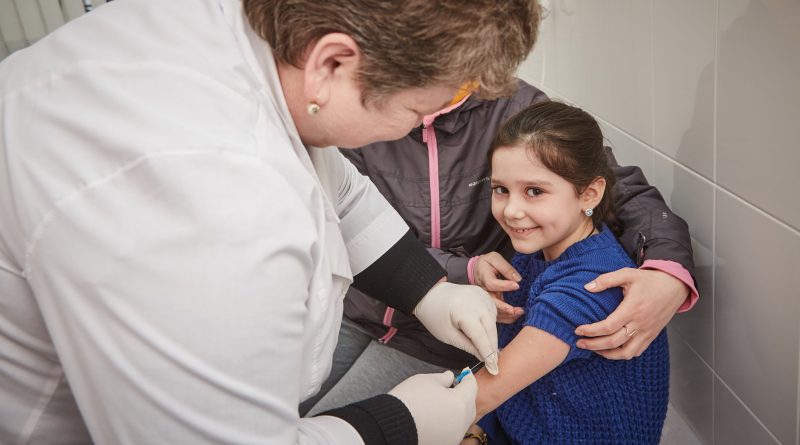 Three-and-a-half-year-old Anastasia Veretka smiles prior to receiving a vaccine at a medical facility in Ivano-Frankivsk, Ivano-Frankivsk Oblast, Ukraine. UN Ukraine/Flickr