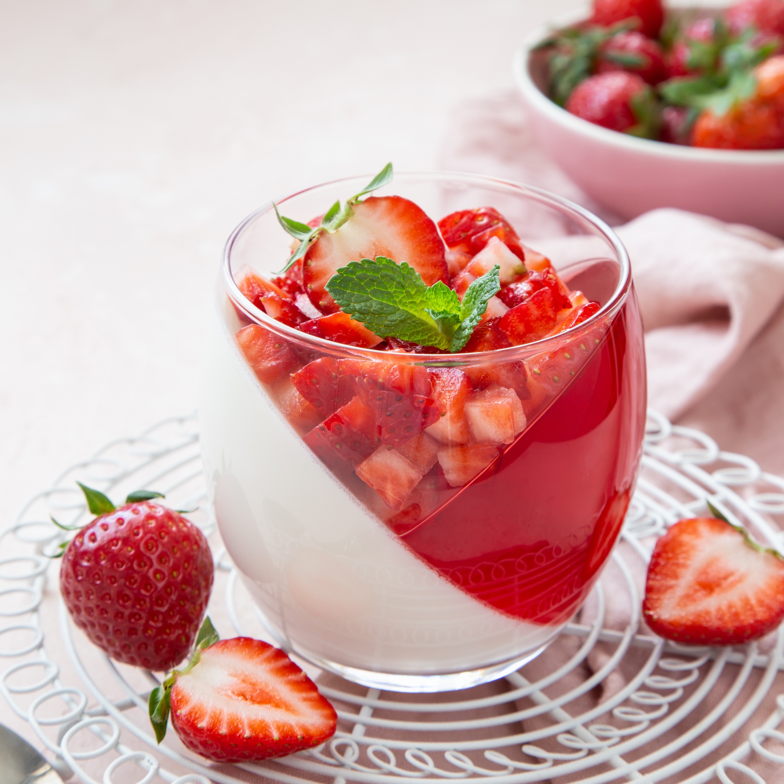 coconut and strawberry jelly layered dessert with fresh strawberries