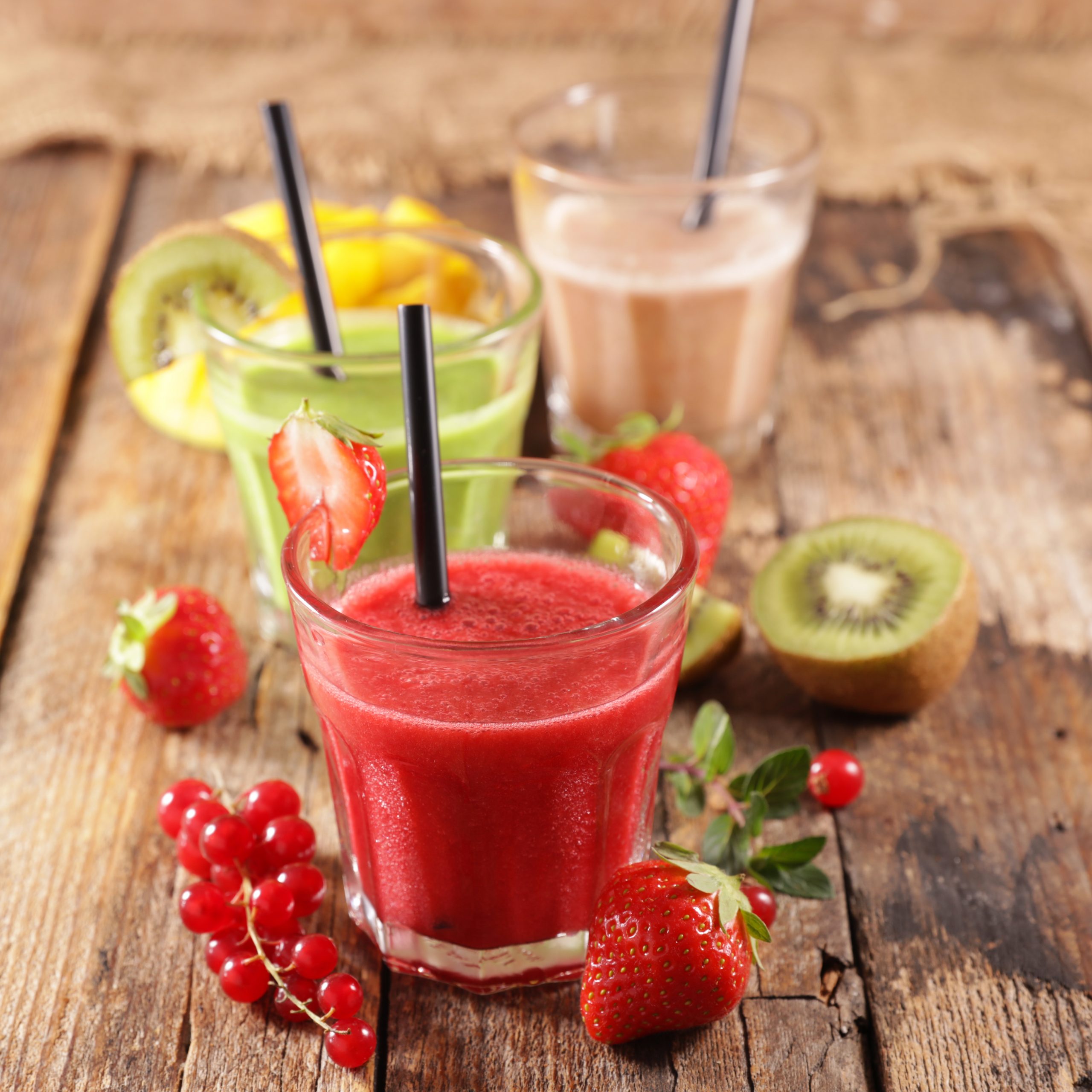 assorted fruit smoothie and fresh fruits