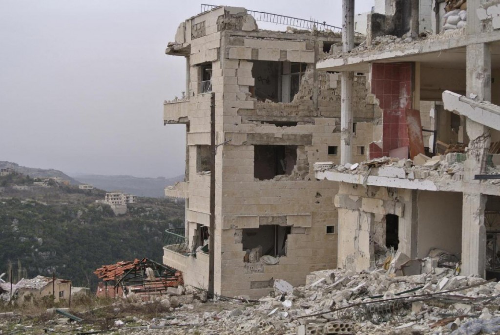 Destroyed buildings are seen in Salma, Syria, Friday, Jan. 22, 2016. Syrian government forces relying on Russian air cover have recently seized Salma, located in Syria's province of Lattakia, from militants. The Syrian government offensive has given Assad a stronger hand going into peace talks with the opposition that are planned for next week in Switzerland. (AP Photo/Vladimir Isachenkov)