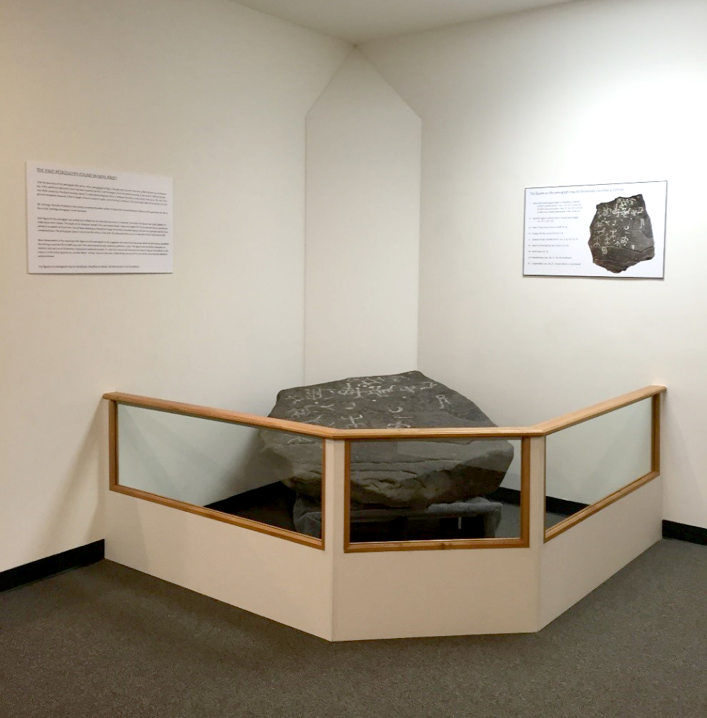 The petroglyph in its new display, outside the Dean's Suite in Walsh Library.