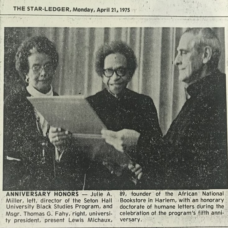 A newspaper clipping from the Star Ledger in 1975 with a photograph of Msgr. Fahy with two Black community leaders
