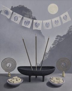 image of incense Aagainst a mountain backdrop