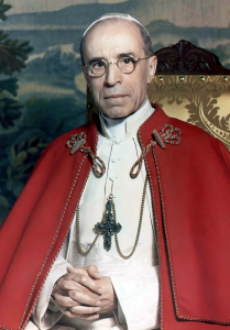 Photograph of Pope Pius XII with red cloak wearing cross