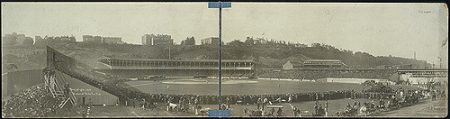 A view from the early days of the Polo Grounds during the 1905 World Series. Notice how fans are standing in the outfield and that there is no fence in the outfield. Also take note of the horses and carriages in the very front of the picture.[10]