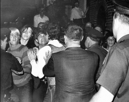 Police officers raided the Stonewall Inn which sparked a series of violent protests. Riots soon erupted as crowds attempted to impede police arrests outside Stonewall Inn. This is one of the very first photos that captured the riot.
