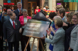 U.S. Assembly member Jerrold Nadler, Mayor Bill de Blasio, Secretary of the Interior Sally Jewel, Valerie Jarrett and NY State Assemblymember Debra Glick unveil the sign designating Stonewall Inn a national monument.