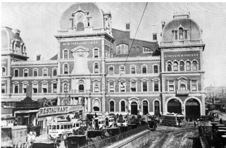 This is an image of the Grand Central Depot. On the building itself, you can see two of the three railroad lines that fell under the NY Central and Hudson Railroad company: NY and Harlem Railroad and New York and New Haven Railroad. On the lower left of the image, you can see people and rail tracks crossed in the same area which were one of the major concerns that led to the downfall of the Grand Central Depot.